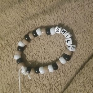 Neutral bracelet that says smile!